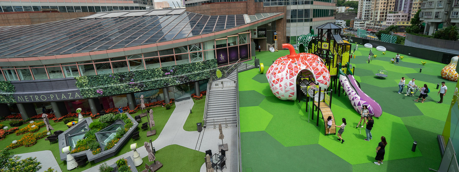 The playground is located next to a shopping center