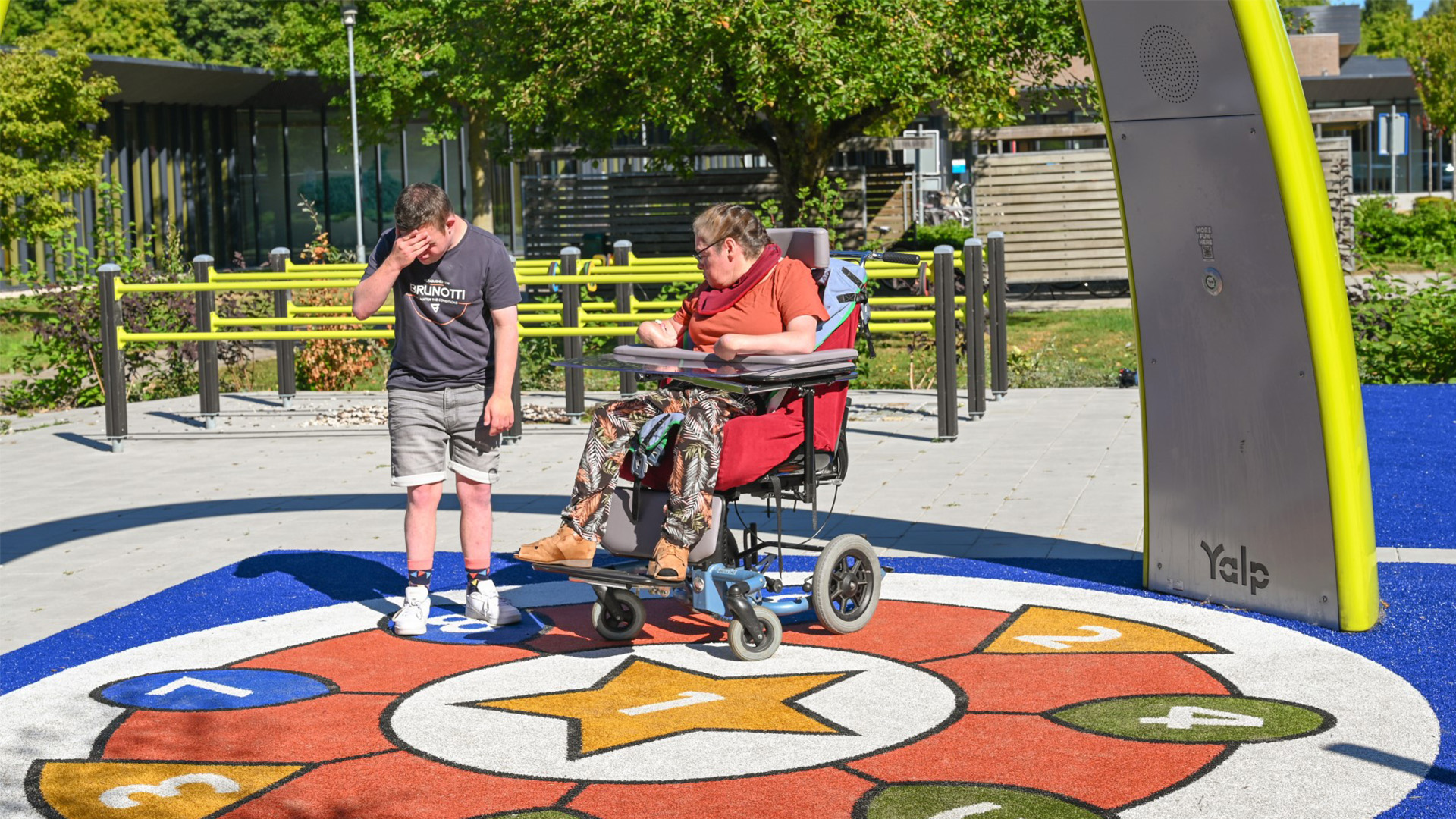 Residents from Ipse de Bruggen playing together under the Lappset Sona Interactive dance and play arch