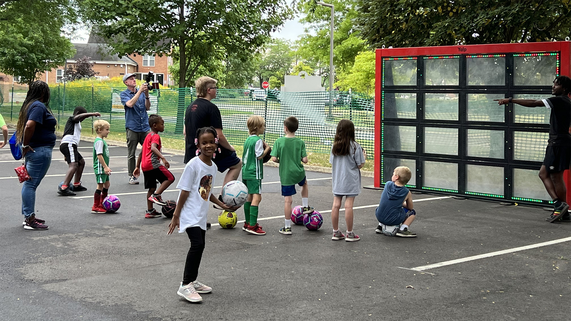 Children playing on the Sutu Interactive ball wall