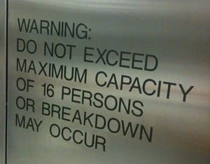 
        do not exceed capacity elevator warning
      