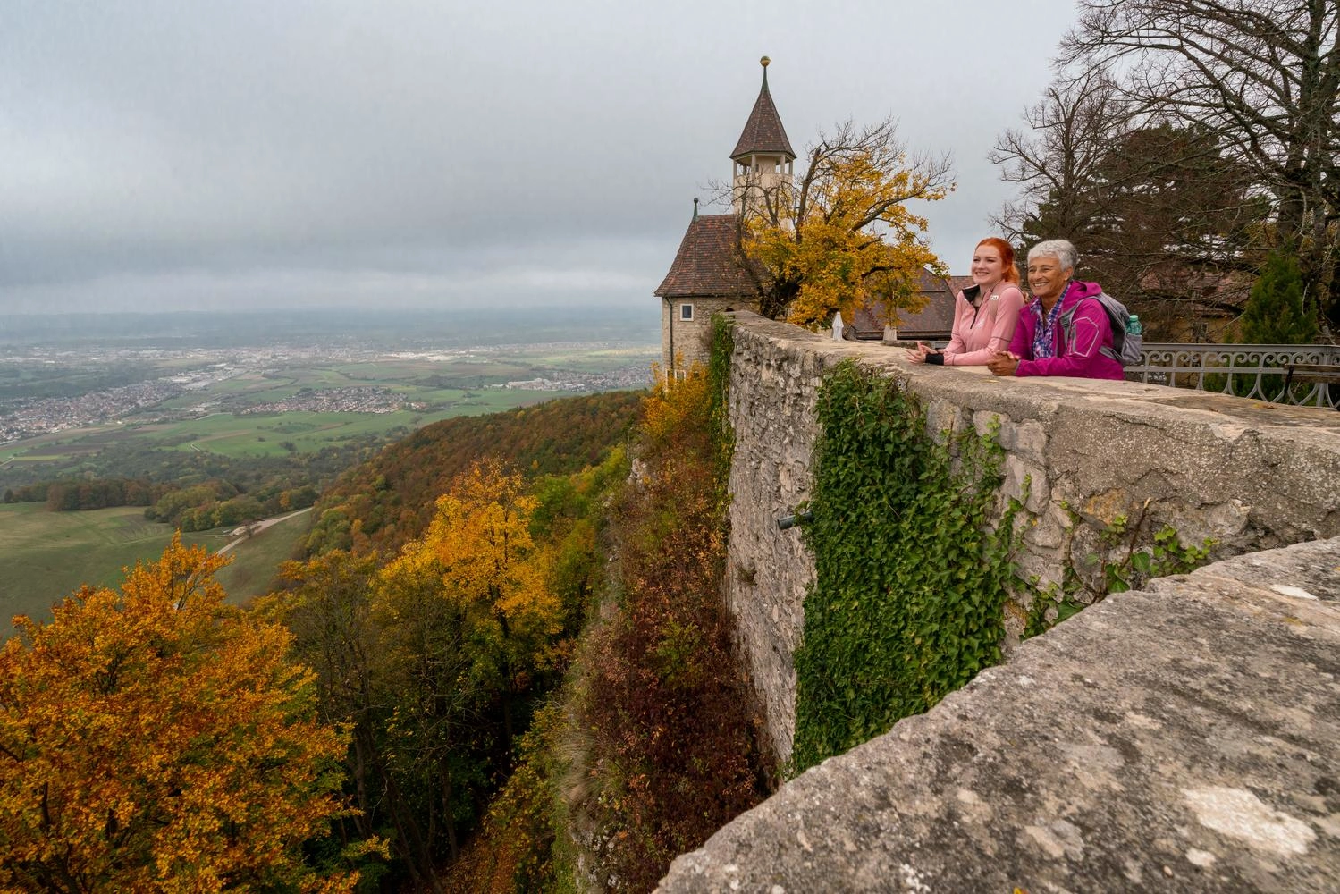 View of Teck Castle, which lies above the Swabian Alb. Autumn trees surround the castle.