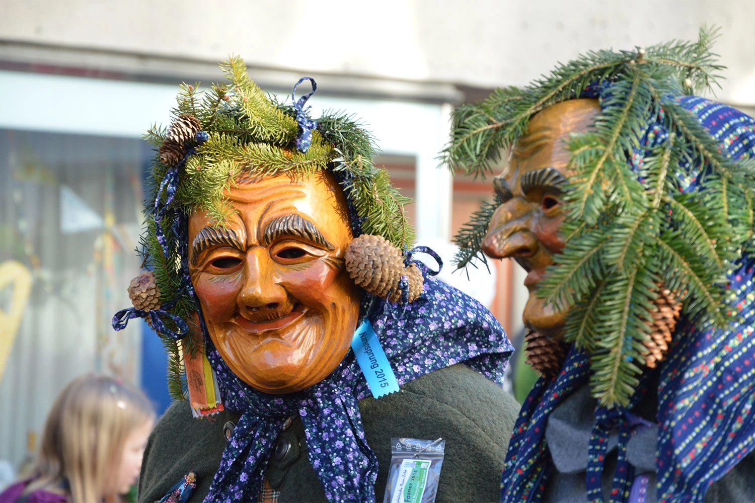 Two members of the carnival club "Schnorrenweible" with friendly looking masks.