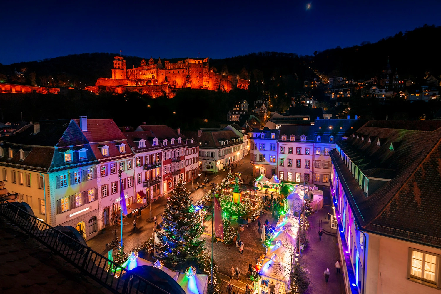 View of a colorfully illuminated square at Christmas time.