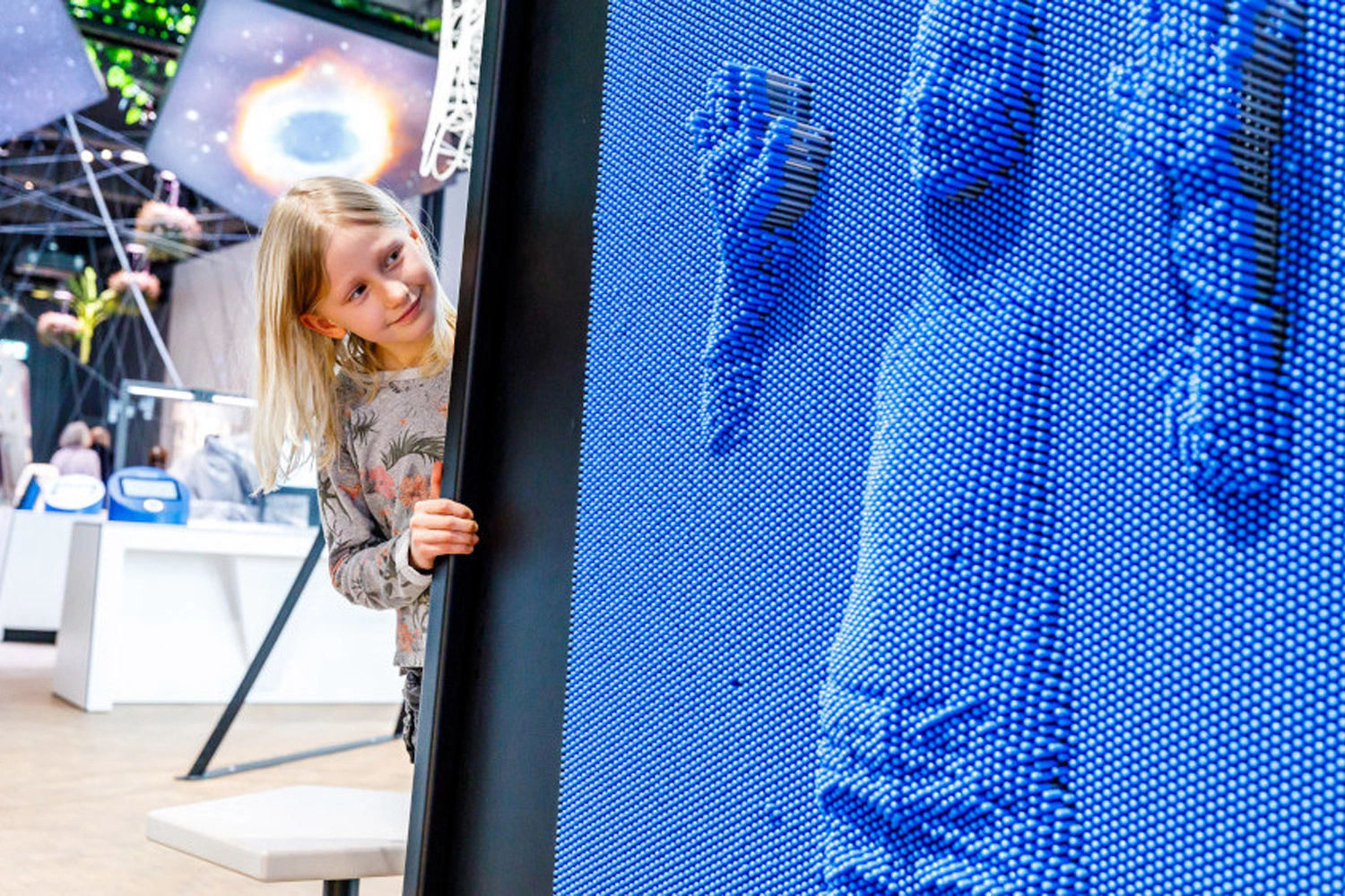 Person stands in front of blue imprint of another person in talent factory