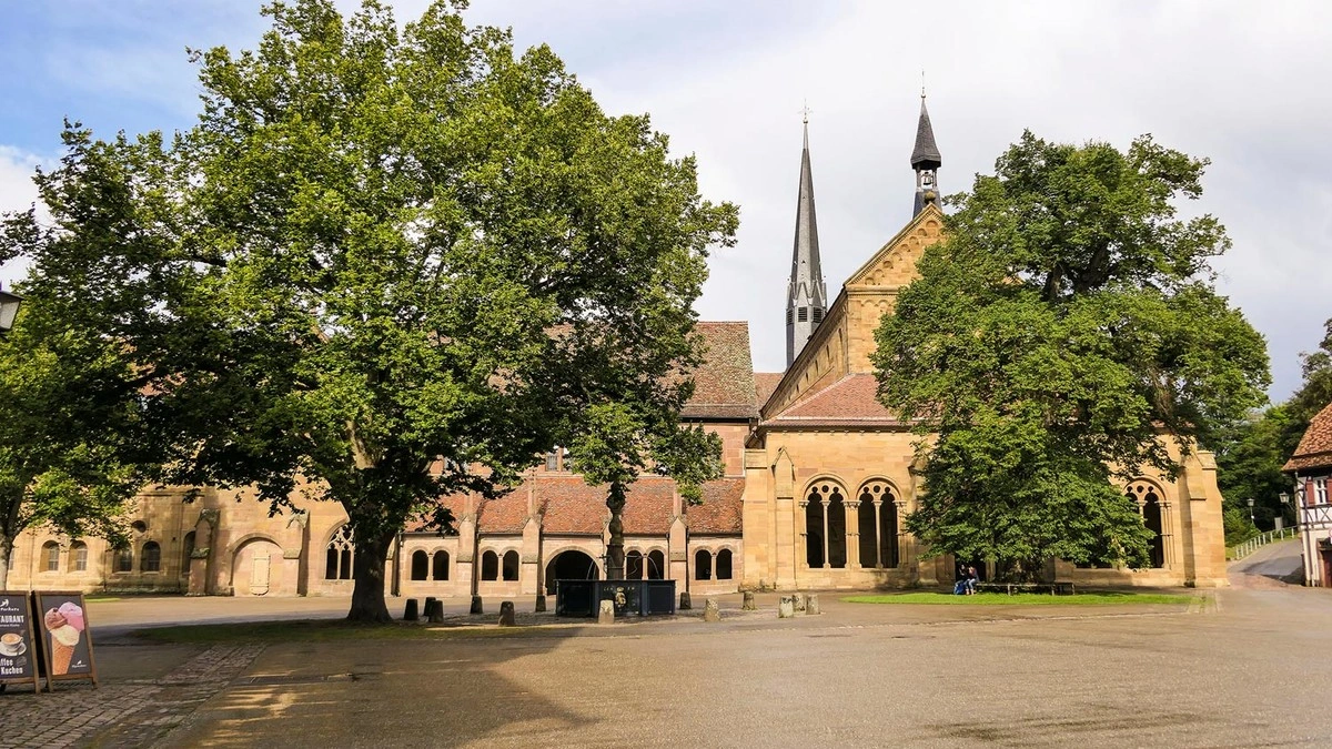 Front view of Maulbronn Monastery with large trees
