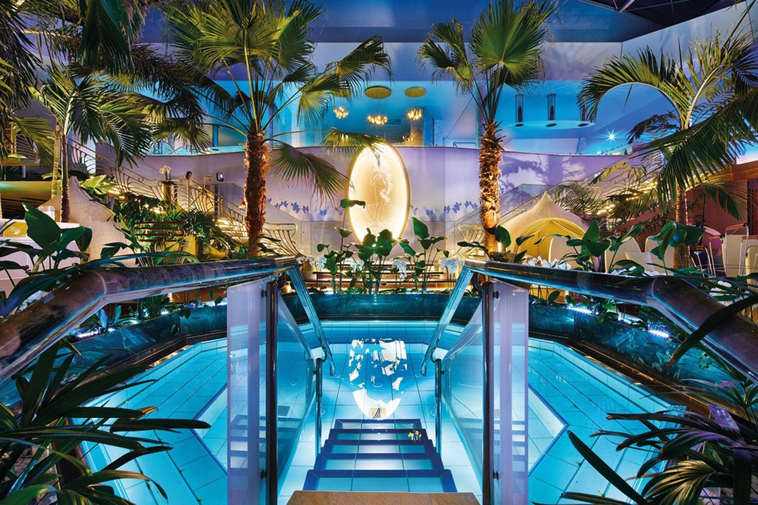 Illuminated swimming pool in the Badeparadies Schwarzwald with dimmed light.