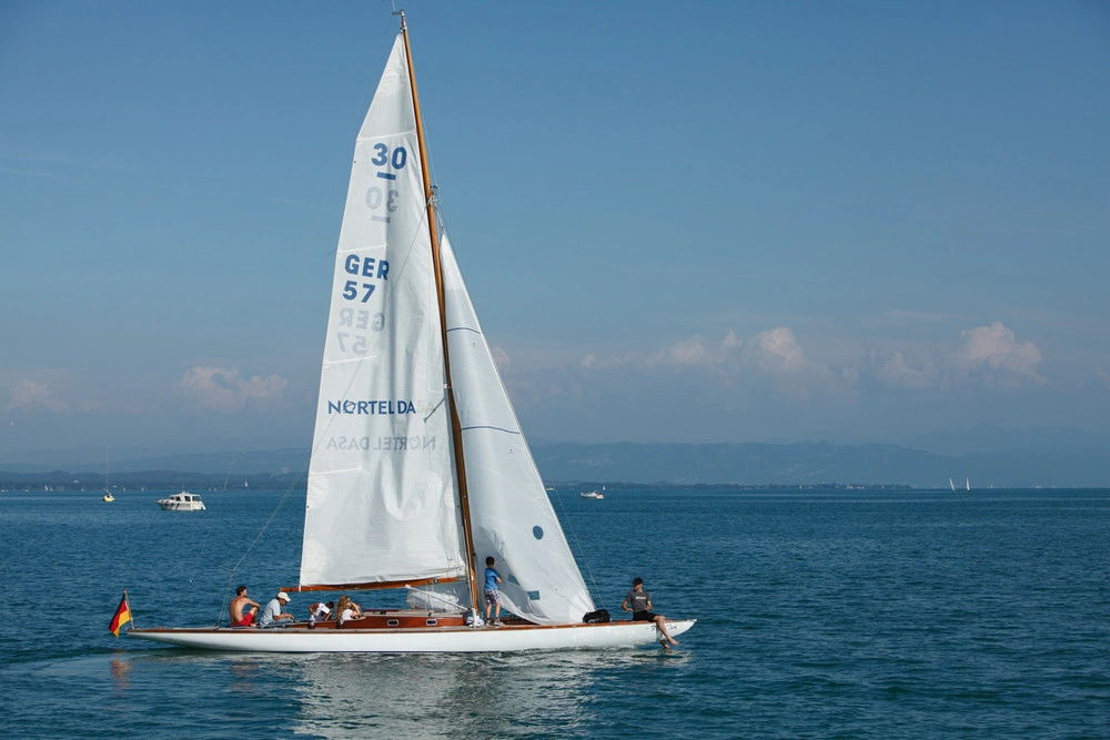 A sailing boat floats on Lake Constance.