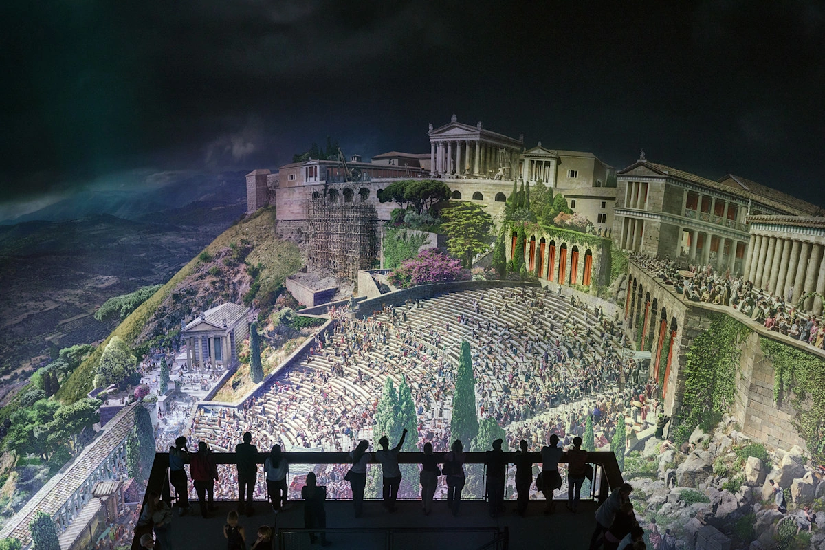People stand on a viewing platform in the Gasometer Pforzheim to watch the 360-degree panorama of the ancient city of Pergamon.