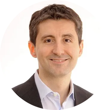 Professional portrait of an Alessandro Catellani, Vice President, Human Resources, P&G Northern Europe in business attire against a neutral background.