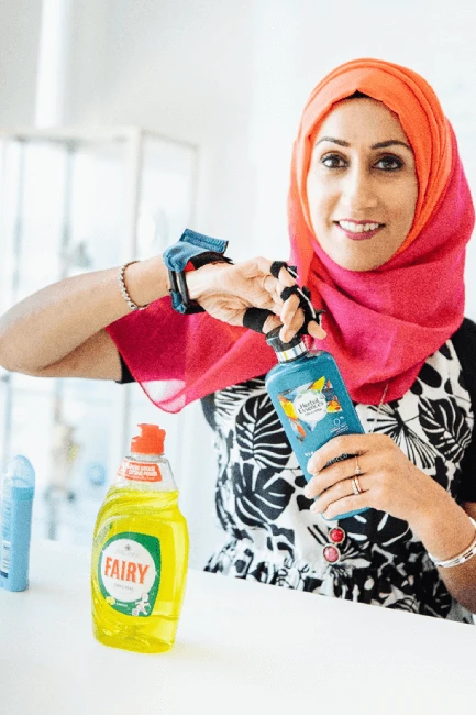 Sam Latif holding Herbal Essences bottle