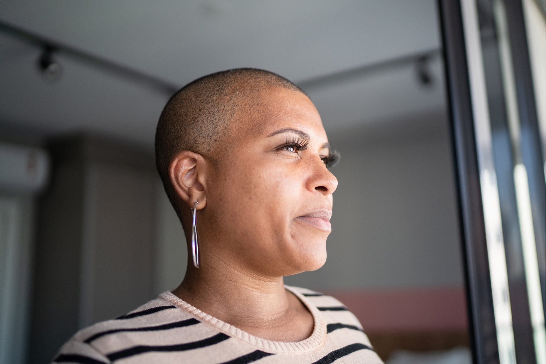 diversity mature woman contemplating at home