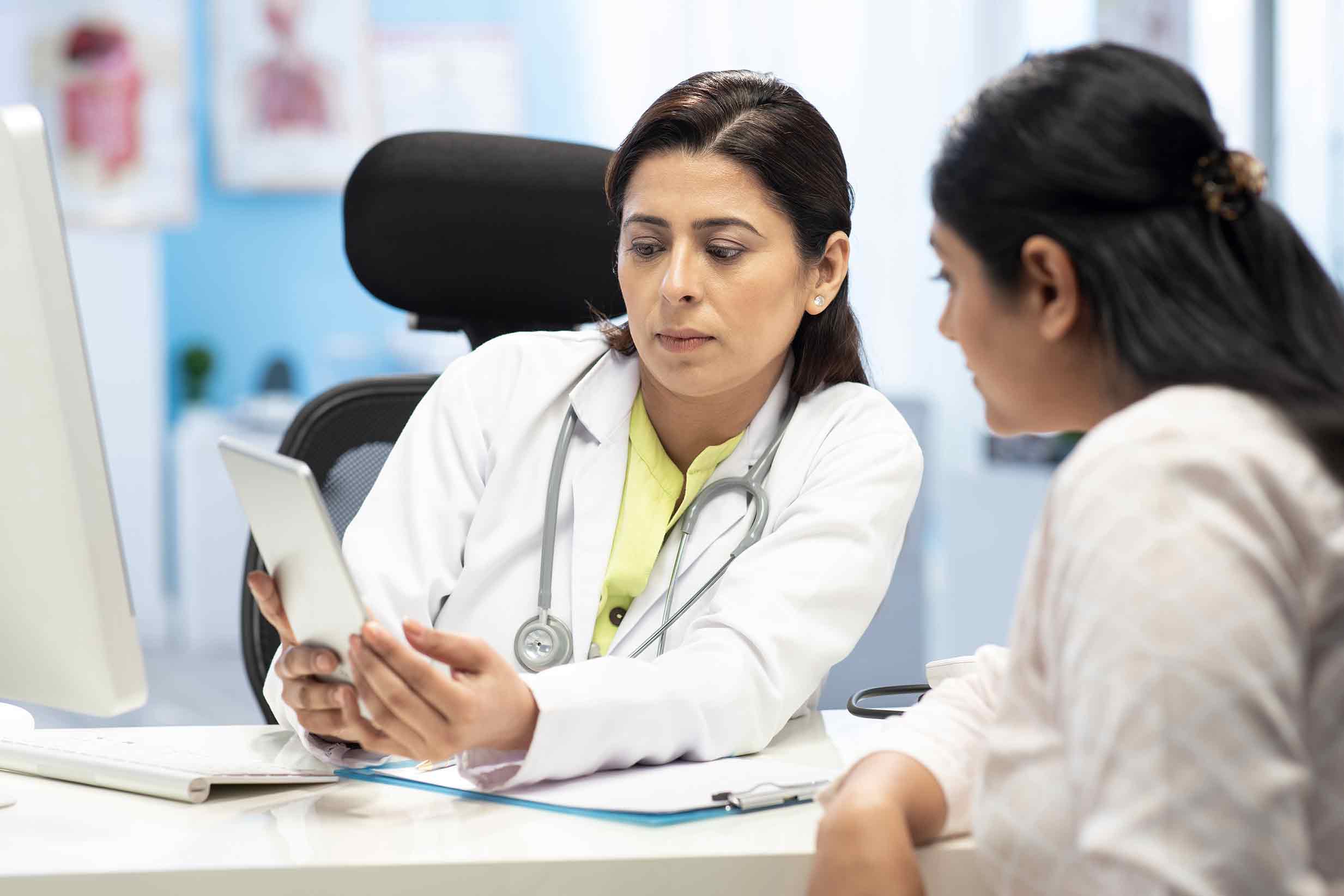 Doctor discussing using RSCliN+ Tool with patient.