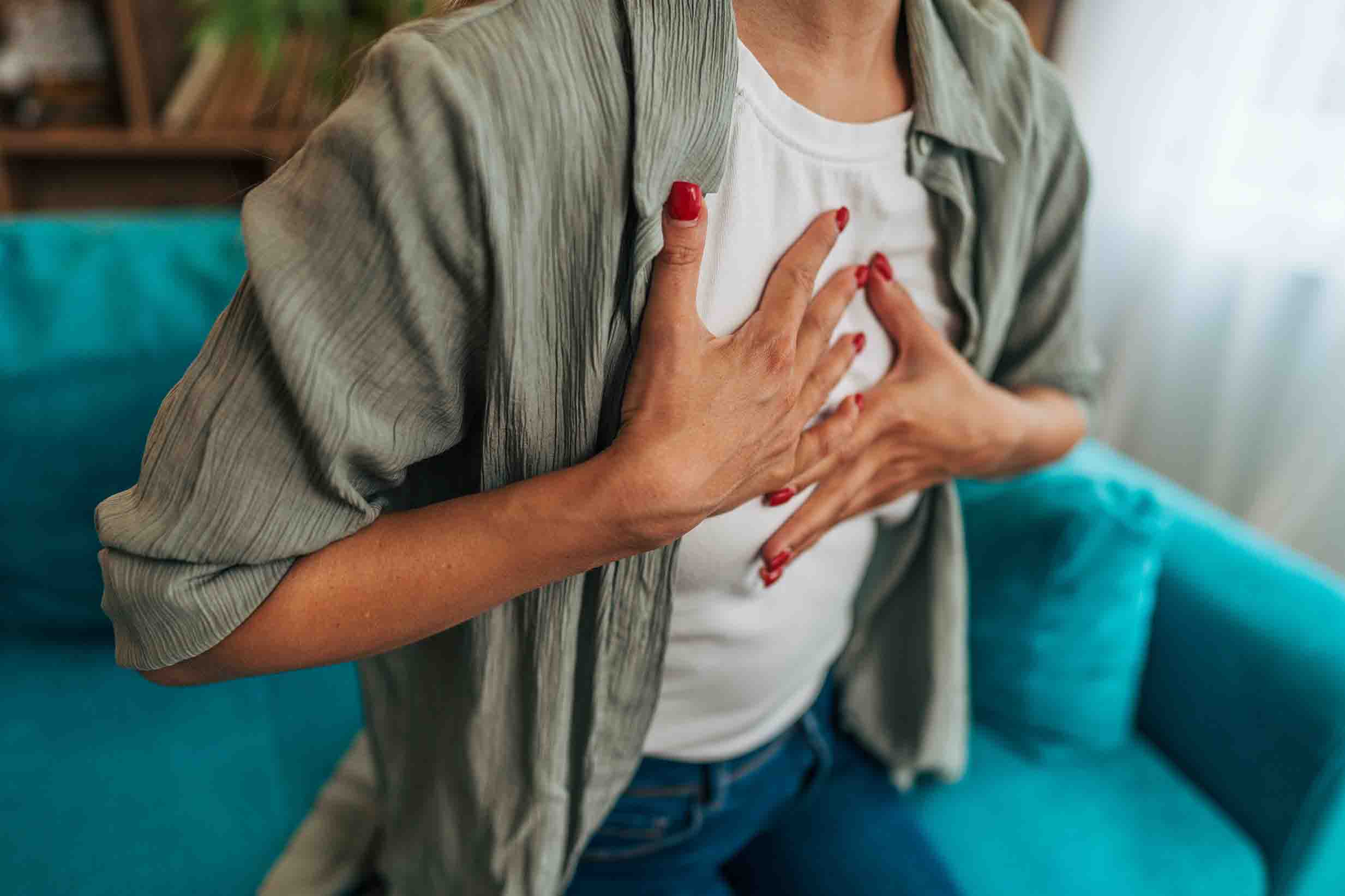 Woman Holding Chest 2466x1644