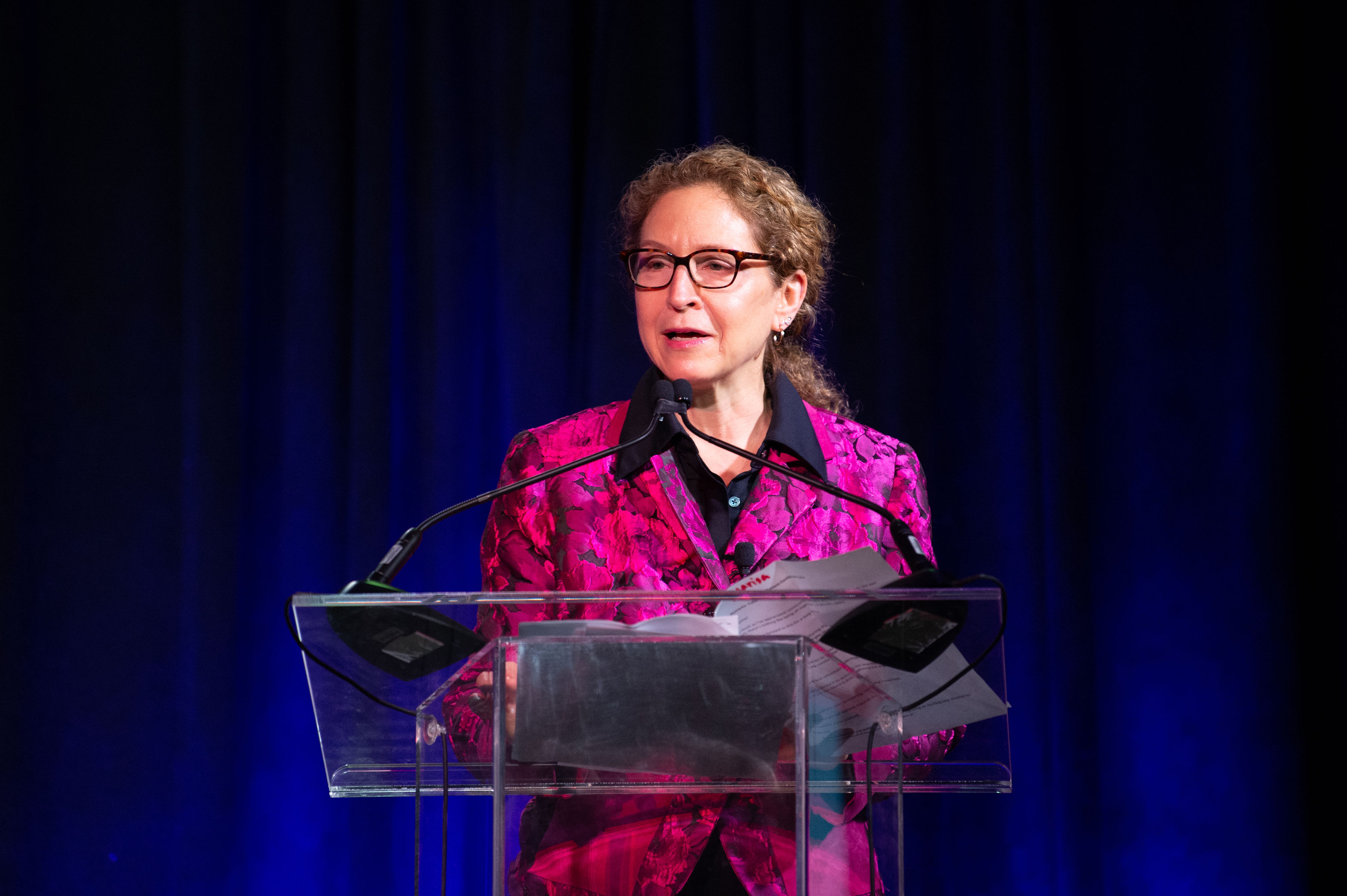 Marisa Weiss MD speaking at podium